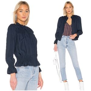 Frame Denim smocked ruffle zip up jacket.